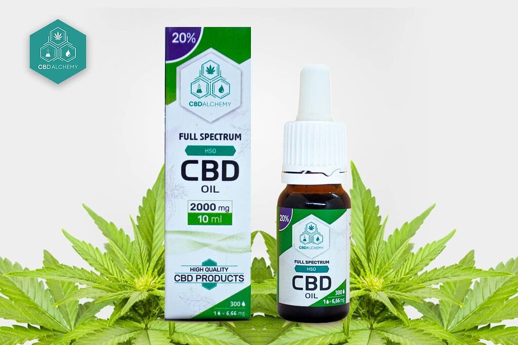 Bottle of CBD oil together with cannabis leaves
